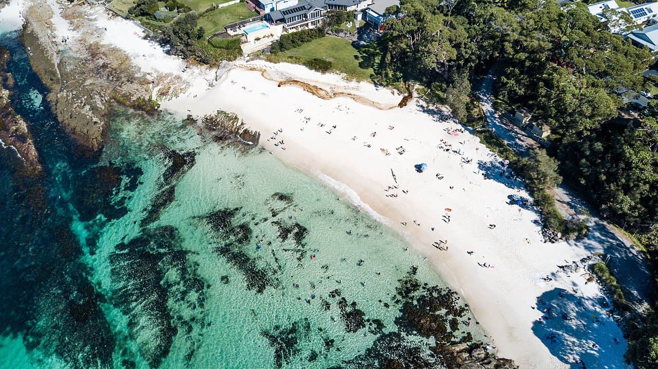 Australia's Hyams Beach with "the whitest sand in the world" has its own overcrowding issues during the summer holiday season. Image by Charliekay [CC BY-SA 4.0] via Wikimedia. https://commons.wikimedia.org/wiki/File:Hyams_Beach_-_Jervis_Bay_Marine_Park.jpg