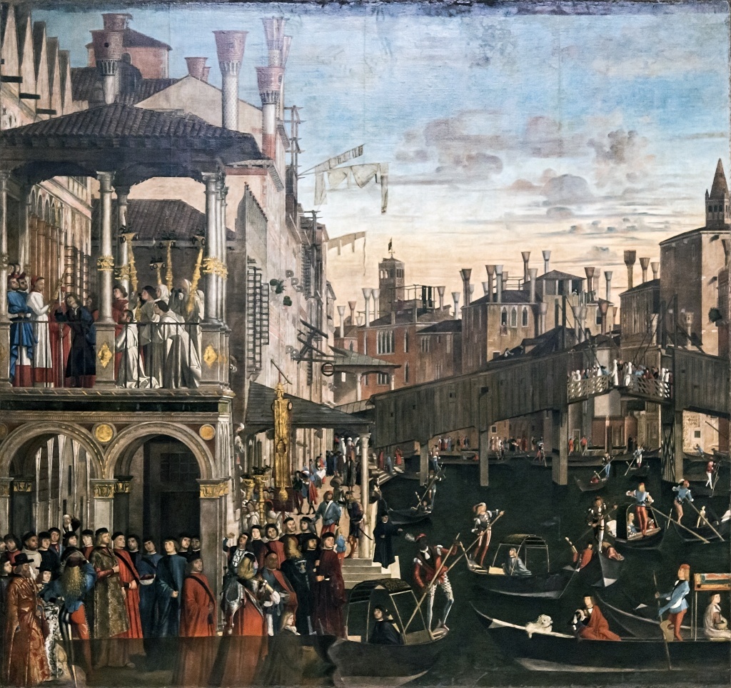 Miracle of the Cross at the Ponte di Rialto by Vittore Carpaccio, c. 1496, (Public Domain) via Wikimedia. https://commons.wikimedia.org/w/index.php?curid=59618127

The subject is the healing of a man possessed performed by Francesco Querini, the Patriarch of Grado, through the intercession of the relic of the Holy Cross in his palace at the Rialto.