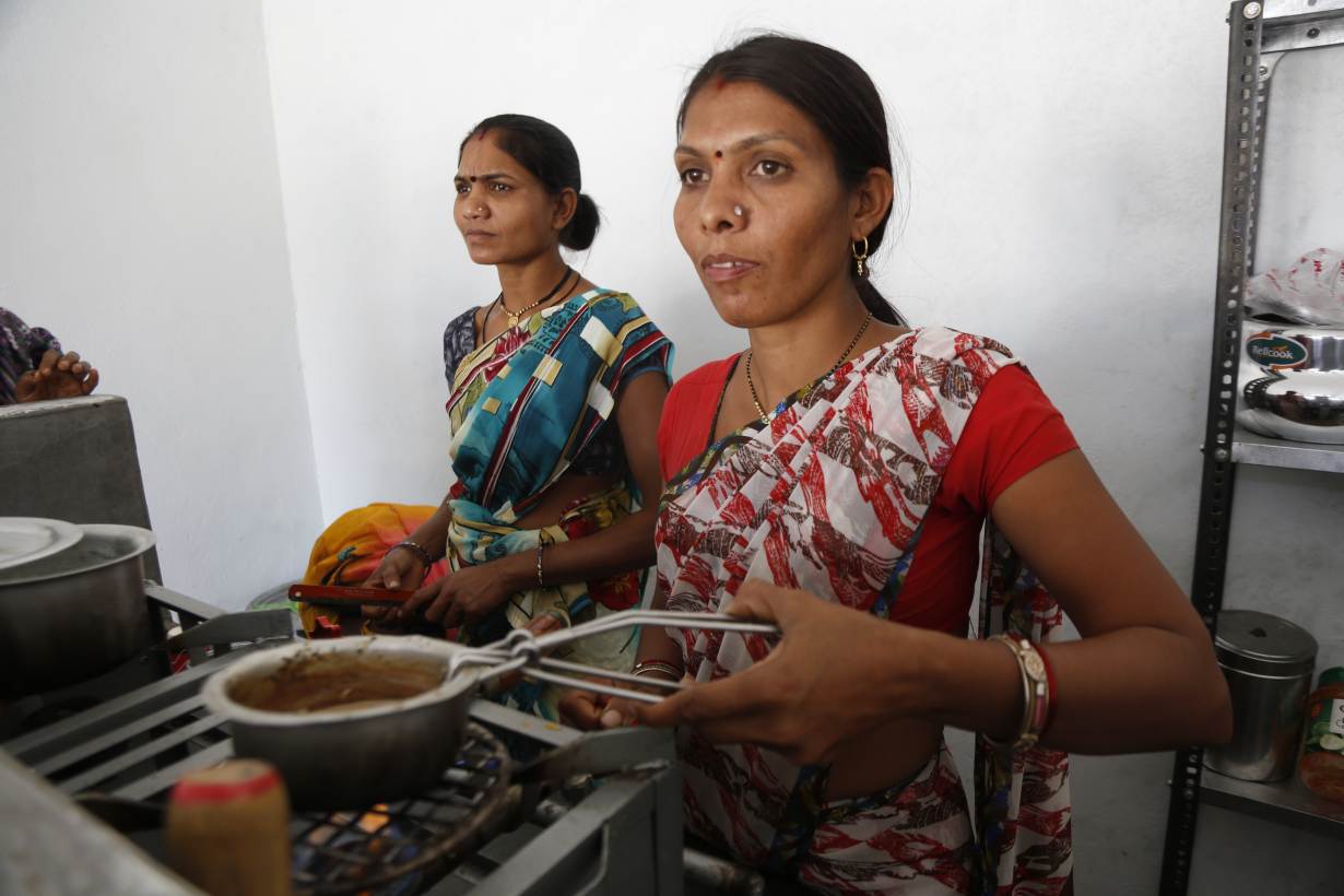 Sandhya Daherwal (R) and her colleague (L) from Turiya village make snacks for customers at their new roadside eatery near Pench Tiger Reserve in central Madhya Pradesh state, India on February 20, 2019. Thomson Reuters Foundation/Annie Banerji