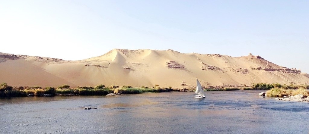 Sailing the Nile in Aswan, Egypt. Image by DEZALB (CC0) via Pixabay. https://pixabay.com/photos/aswan-nile-felucca-cataract-3344729/