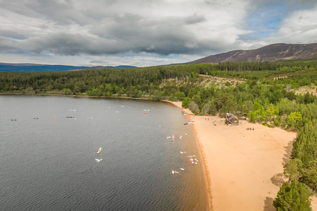 Loch Morlich in the Cairngorms National Park had issues of irresponsible camping and littering. These were addressed through targeted marketing thanks to a partnership between VisitScotland, the national park, and other stakeholders. Image: VisitScotland / Airborne Lens