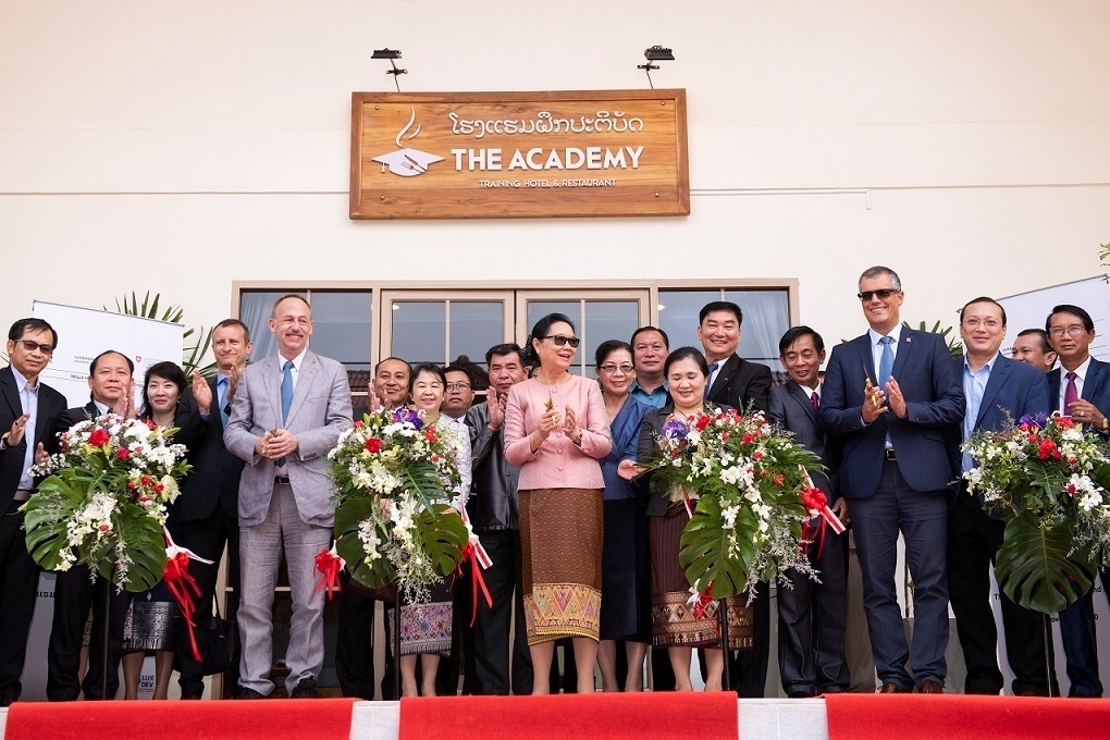 At the inauguration of The Academy Training Hotel and Restaurant. Image via WeAreLao. https://wearelao.com/blog/edit-blog-entry-%E2%80%98-academy-training-hotel-and-restaurant%E2%80%99-opens-its-doors-vang-vieng